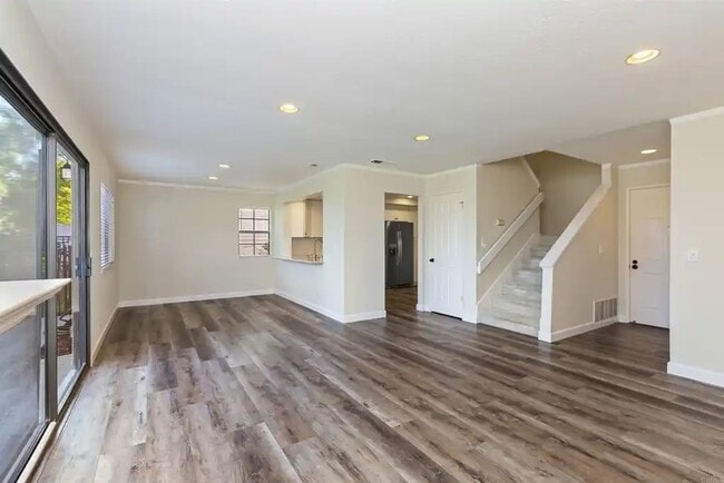 Building Photo - Upgraded La Costa Townhome