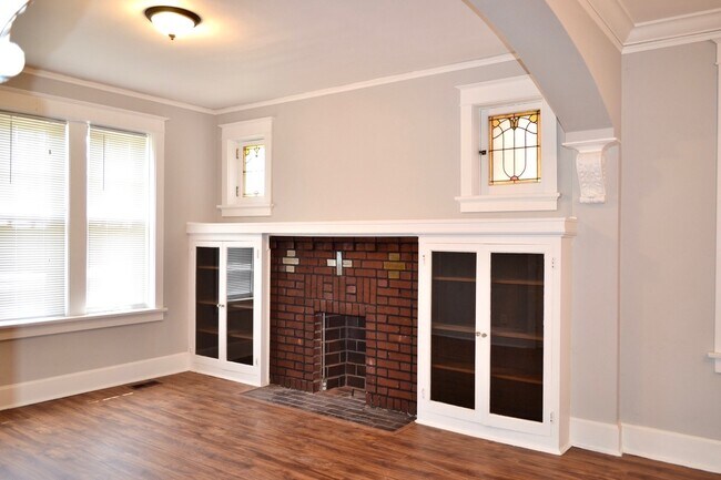 Fireplace area has outlets for your plug ins. - 4919 Murdoch Ave