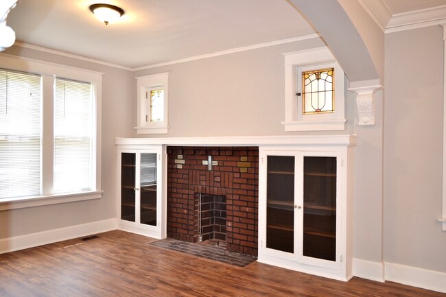Fireplace area has outlets for your plug ins. - 4919 Murdoch Ave