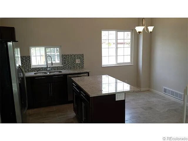Kitchen island + dining area - 2957 S Revere St