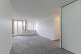 Located at 1900 Bloor St E in Mississauga, this well-appointed 3-bedroom, 3-bathroom unit offers a generous and functional layout across a single floor. The kitchen features white cabinetry with dark countertops, tile backsplash, tile flooring, and white appliances including an electric range. Its open-facing design connects seamlessly to the carpeted living area, creating an easy flow throughout the main living spaces. The bedrooms are bright and comfortable, with classic parquet wood flooring and large windows fitted with vertical blinds that allow plenty of natural light to filter in. The primary bedroom is notably spacious, offering room for a full furniture arrangement and convenient access to an ensuite bathroom. Each of the three bathrooms is distinctly appointed — one features a decorative oval mirror with elegant vanity lighting above white cabinetry, another offers a bold patterned mirror frame with a marble-style countertop, and a third presents a clean, minimalist design with mosaic tile flooring. A private balcony extends the living space outdoors. Throughout the unit, neutral tones and clean finishes create a bright, move-in-ready environment suitable for a variety of lifestyles.