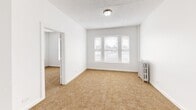 This 670 square foot single-story home in Chicago's South Side offers a unique layout with 5 bedrooms and 1 bathroom. The property has undergone recent renovations, evident in its fresh, neutral color palette and updated fixtures. Each bedroom features wall-to-wall carpeting and windows that allow natural light to flood the spaces. The primary bedroom, measuring 140 square feet, provides a comfortable retreat.

The home's single bathroom showcases modern amenities, including a tiled shower/tub combination and a white vanity. The kitchen, while compact, is efficiently designed with gray cabinetry, a gas range, and a refrigerator. Tiled flooring in the kitchen adds a practical touch.

Throughout the home, white walls and trim create a bright, airy atmosphere. Vintage radiators in some rooms add character while providing warmth. The property's layout includes two hallways, enhancing flow between rooms. Despite its modest size, the home maximizes space usage, offering a surprising number of bedrooms for its square footage. Located in the 60620 zip code, this property presents an interesting option for those seeking a multi-bedroom home in a compact footprint.