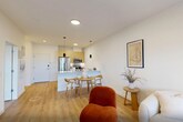 Located at 431 Main Street in East Orange, NJ, this thoughtfully designed one-bedroom, one-bathroom unit offers a clean, modern aesthetic across a well-utilized single floor. The open-concept kitchen and living area serves as the heart of the home, featuring light hardwood flooring that flows seamlessly throughout. The kitchen is equipped with stainless steel appliances, including a full-size refrigerator and range, complemented by light wood cabinetry and sleek countertops. The living room is bright and airy, benefiting from natural light through large windows and a glass door that opens to a balcony, creating an inviting, open atmosphere. The generously sized bedroom offers a tranquil retreat with a large double-door closet, hardwood flooring, and a window that fills the room with natural light. The bathroom features a modern floating vanity with an under-mount sink, a mirrored medicine cabinet, and clean white finishes that contribute to its crisp, minimalist design. Throughout the unit, the consistent use of white walls, warm wood tones, and contemporary fixtures creates a cohesive and sophisticated ambiance, ideal for those seeking a stylish and functional living space in East Orange.