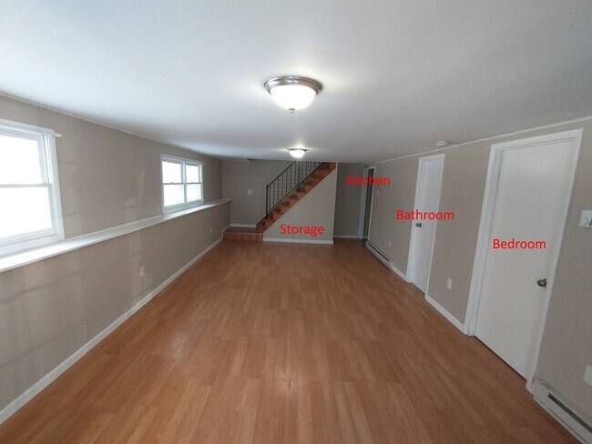 First floor living room with access to kitchen, bathroom and first bedroom - 46 Sunset Cir