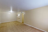 This 630 square foot apartment in Houston, TX offers a practical living space with a thoughtful layout. The single-story unit comprises one bedroom, one bathroom, and a living room, providing essential amenities in a compact design. The primary bedroom, measuring 200 square feet, offers ample space for comfortable living.

Throughout the apartment, parquet flooring adds a touch of classic elegance and warmth. The neutral-toned walls create a blank canvas, allowing for personalization while maintaining a bright, airy feel. Windows in various rooms invite natural light, enhancing the sense of space and openness.

The living area is versatile, with potential for multiple furniture arrangements. A notable feature is the spacious closet area, providing generous storage solutions. The bathroom, while compact, is efficiently designed with a shower-tub combination and clean, white tiling.

The apartment's layout, as seen in the 3D floor plan, shows a well-organized space that maximizes functionality. Recessed lighting fixtures contribute to the modern aesthetic while ensuring good illumination throughout. This apartment at 8655 Pitner Road offers a cozy, low-maintenance living option in a convenient Houston location.
