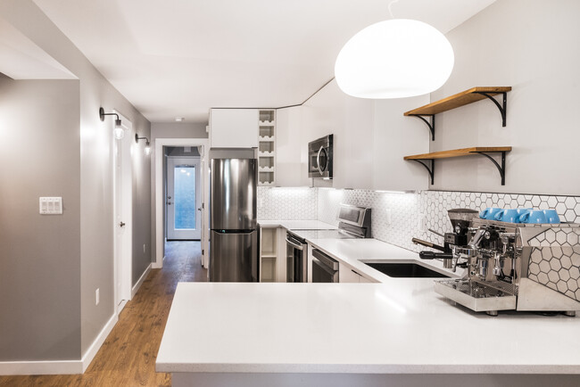 Kitchen with view out rear access - 523A Irving St NW