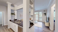 Located at 4700 City Ave in Philadelphia, PA, this well-appointed one-bedroom, one-bathroom residence offers a thoughtfully designed single-floor layout with a comfortable, functional flow throughout. The living room is a bright, welcoming space highlighted by crown molding, hardwood-style flooring, and large French doors that open to a private balcony with lush tree-lined views. A ceiling fan adds practical comfort to the airy room.

The kitchen is efficiently designed with white cabinetry, dark granite countertops, stainless steel appliances including a refrigerator and dishwasher, and a peninsula that separates it from the living area. Built-in open shelving adds display and storage versatility. A walk-in pantry/closet provides additional storage.

The spacious bedroom features plush carpet, elevated ceilings, and a generous bay window that fills the room with natural light and greenery views. Two closets offer ample storage.

The full bathroom is well-sized, featuring a large soaking tub with tile surround, a separate shower stall, tile flooring, and a wide vanity with granite countertops and white cabinetry. A hallway connects the key living spaces, completing this comfortable and stylishly finished residence.