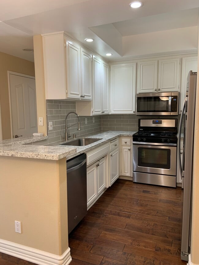 New kitchen - granite and backsplash - 14415 Benefit St