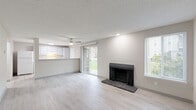 Located at 1007 130th Ave SW in Everett, WA, this 2-bedroom, 3-bathroom single-floor unit offers a well-organized and functional layout. The open-concept living, dining, and kitchen area serves as the heart of the home, featuring light wood-style flooring, a textured ceiling, and a ceiling fan. A classic fireplace anchors the living room, while a sliding glass door floods the space with natural light and provides direct access to a green outdoor area. Windows fitted with blinds add to the bright, airy atmosphere throughout.

The kitchen is designed with efficiency in mind, featuring a pass-through breakfast bar, white cabinetry, a white appliance suite including a range and refrigerator, and a modern pull-down faucet — all set against light countertops that complement the neutral color palette.

Both bedrooms are carpeted for comfort, offering natural light through window blinds and wall heating units. The primary bedroom provides a generous footprint with dedicated closet space. Five closets throughout the unit ensure abundant storage.

The three bathrooms are clean and functional, outfitted with light cabinetry, white countertops, and tub-shower combinations. A connecting hallway ties all rooms together seamlessly, creating a cohesive and practical living environment.