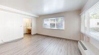 Located at 2606 Newhall Street in Santa Clara, CA, this single-floor, one-bedroom, two-bathroom unit offers a thoughtfully laid-out living space. Light-toned laminate wood flooring runs throughout, creating a clean, cohesive look across every room.

The open-concept kitchen and living area is bright and functional. The kitchen features light maple cabinetry with ample storage, stainless steel appliances including a full-size refrigerator and electric range, a built-in sink, and a skylight-style overhead fixture that keeps the space well-lit. A window with blinds brings in natural light and connects the area to the outdoors.

The bedroom is a comfortable, well-proportioned room with a large window allowing natural light to filter in, a wall-mounted HVAC unit, and a sliding closet door for storage.

Both bathrooms are designed with accessibility in mind. The primary bathroom includes a wide vanity with drawers, a large mirror, open under-sink clearance, and an adjoining room with a full tub-shower combination equipped with multiple grab bars. The second bathroom is similarly practical and clean in design.

Throughout, the unit maintains a bright, neutral palette with white walls and an open, airy ambiance — offering a practical and comfortable living environment in the heart of Silicon Valley.