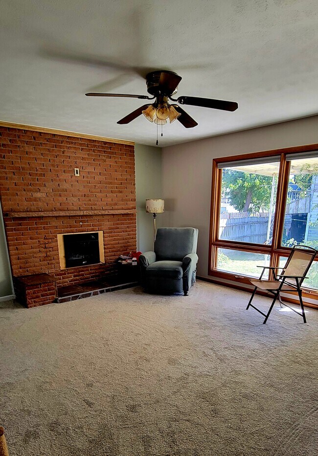 Large living room, new carpet and fireplace.ireplace - 5323 Calvert St