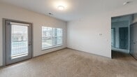 This 890 square foot apartment offers a thoughtful blend of comfort and functionality. The single-story layout comprises one spacious bedroom measuring 250 square feet, complemented by two well-appointed bathrooms. The open-concept design seamlessly integrates the living areas, creating a sense of spaciousness and flow.

The kitchen is a standout feature, boasting modern stainless steel appliances, ample cabinetry, and a sleek granite countertop with a breakfast bar. Pendant lighting adds a touch of sophistication, while the adjacent dining area transitions smoothly into the carpeted living room.

Large windows throughout the apartment invite natural light, enhancing the bright and airy ambiance. The bedroom, also carpeted, offers ample space and includes a closet for storage. The bathrooms are designed with practicality in mind, featuring clean lines and essential fixtures.

A hallway with warm wooden flooring connects the various spaces, while a dedicated closet provides additional storage. The apartment's crowning feature is a private balcony, offering views of the surrounding community, including landscaped grounds and parking areas.

Located in a modern multi-story complex at 4540 Gender Rd, this apartment combines contemporary living with convenience, making it an ideal choice for those seeking a compact yet well-designed living space.