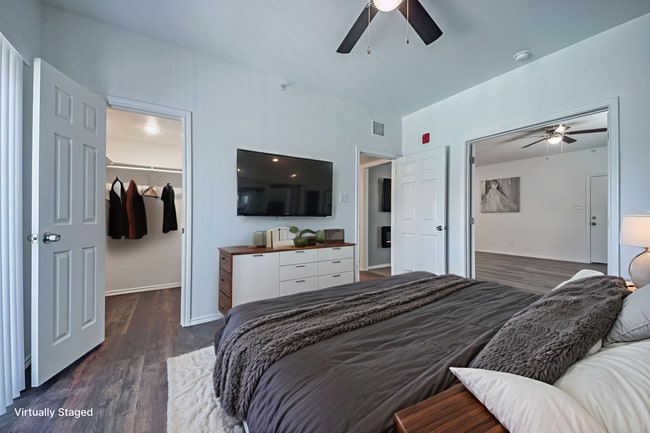 virtually staged photo of main bedroom - 11234 Park Central Pl