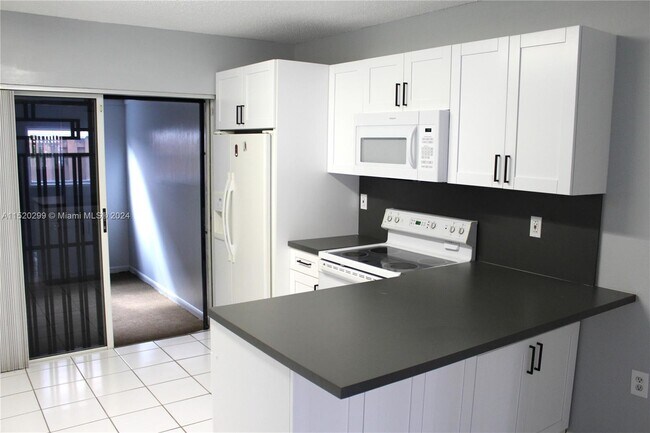 Building Photo - 7692 W 29th Ln