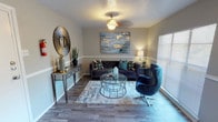 Located at 3226 Persimmon Rd in Dallas, Texas, this single-floor residence combines contemporary style with functional design throughout. The living room serves as a welcoming focal point, featuring wood-look flooring, a textured ceiling, and an elegant pendant light fixture. Large windows allow natural light to fill the space, complementing the warm, neutral wall tones and a decorative chair rail that adds architectural character.

The galley-style kitchen is efficiently laid out with white cabinetry, speckled countertops, a stainless steel sink, and black appliances including a range and refrigerator, offering a clean and practical workspace.

The bedrooms are generously sized, each finished with the same wood-look flooring and neutral walls. The primary bedroom is notably spacious, featuring a window for natural light and ample room for a full furniture arrangement. A second bedroom offers a comfortable and well-proportioned layout as well.

Two bathrooms serve the home, each finished with speckled countertops, white cabinetry, and wood-look tile flooring. One bathroom features a full shower-tub combination with clean white tile surround, while the other provides a vanity with a large mirror. Throughout, the home maintains a cohesive, modern aesthetic with consistent finishes and a well-designed, flowing layout.