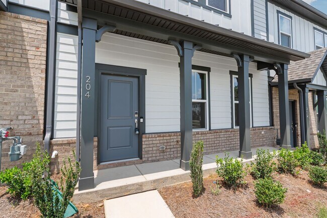 Building Photo - Welcome home to this stunning brand-new townhome in one of Indian Trail's newest and most desirab...