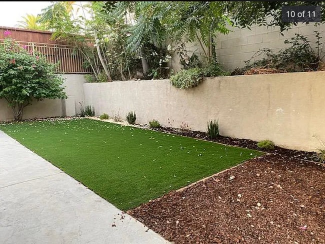 Newly landscaped private backyard - 6949 Elmo St