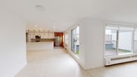 Located at 122 Riverside Ave in Red Bank, NJ, this thoughtfully designed single-floor residence offers a seamless blend of modern aesthetics and functional living. The open-concept living and kitchen area is anchored by large-format terrazzo-style tile flooring and abundant recessed lighting. Expansive sliding glass doors draw in natural light and provide direct access to an outdoor area with a lush green yard.

The kitchen is a standout feature, showcasing an oversized waterfall-edge quartz island, a combination of sleek white high-gloss upper cabinetry and warm wood-grain lower cabinets, a gray subway tile backsplash, and stainless steel appliances. A series of geometric pendant lights adds a striking design element overhead. A dedicated pantry offers additional storage.

The bedrooms feature classic parquet hardwood flooring and bright white walls, creating clean, versatile spaces. The full bathroom is elegantly appointed with marble-look tile flooring, large-format gray wall tiles, a frameless sliding glass tub-shower enclosure, and a wood-toned vanity with a white quartz countertop. A separate half bath features a dramatic floor-to-ceiling dark stone accent wall, a gold-framed oval mirror, and a wood vanity. The private balcony delivers impressive panoramic views of the Navesink River and Red Bank marina.