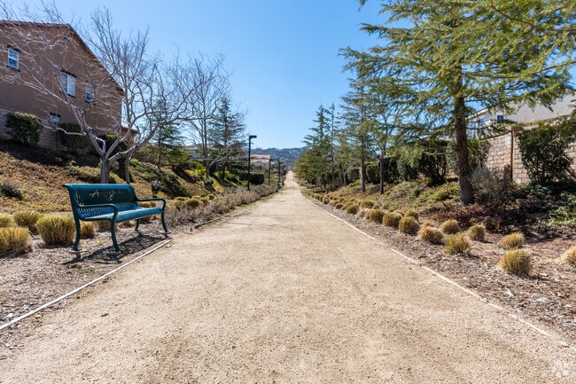 A walking trail nestled between homes.