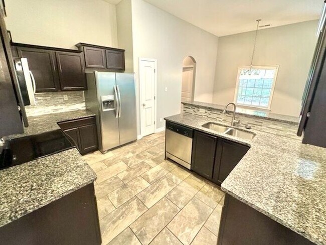 Building Photo - Now Leasing a spacious 4-bedroom 3 bath ho...
