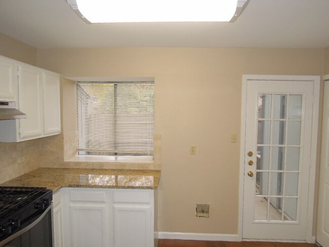 Building Photo - Bright & Spacious 2-Bedroom Condo in Gated...