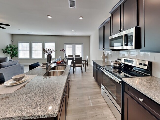 Building Photo - Come Tour! Newly Built 4BR model Townhome ...