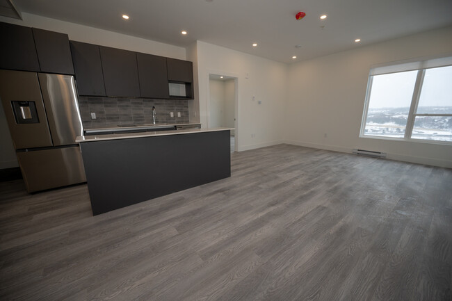 Building Photo - Beautiful New 1 Bed + Den