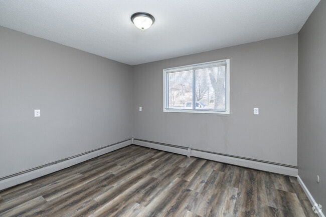 2BR, 1BA - 860SF - Primary Bedroom - Centennial &amp; Heritage Apartments