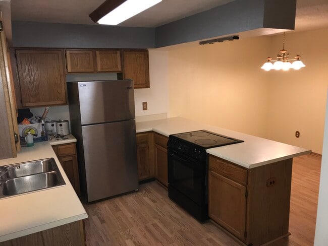 Kitchen opens to dining and frontroom - 6944 W Mississippi Ave